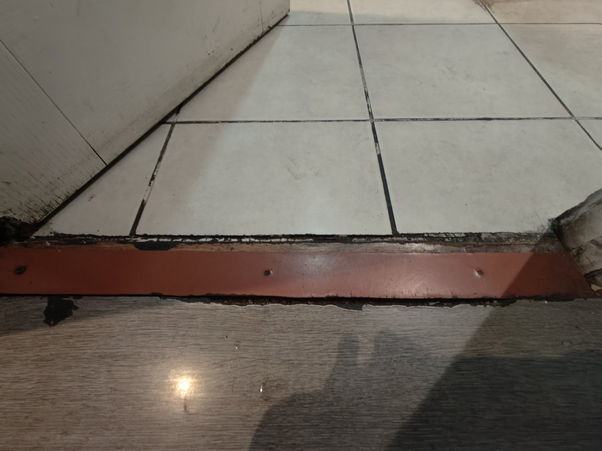 Small bump on threshold of door.