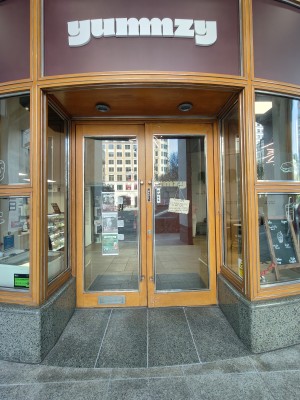 Wooden frames glass doors. Pull silver handles in centre to open.