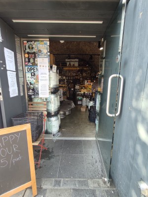 Glass door. Pull silver handle on left to open.