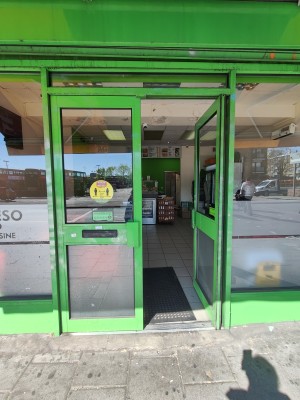 Green framed glass doors. Push green handles in centre to open.
