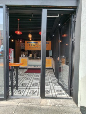Sliding entrance door on left. Main entrance on right.
