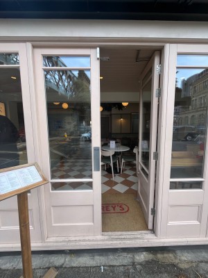 Pink framed glass doors. Push from centre to open.