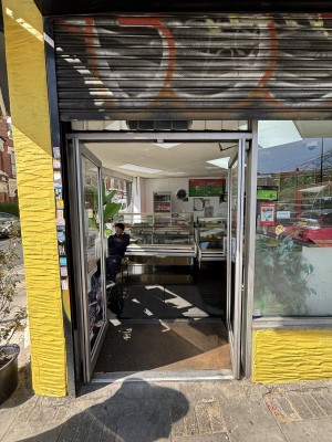 Glass doors with metal frame. Push doors to open from center.
