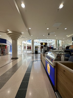 Opening ahead. Counter along right. Seating behind.