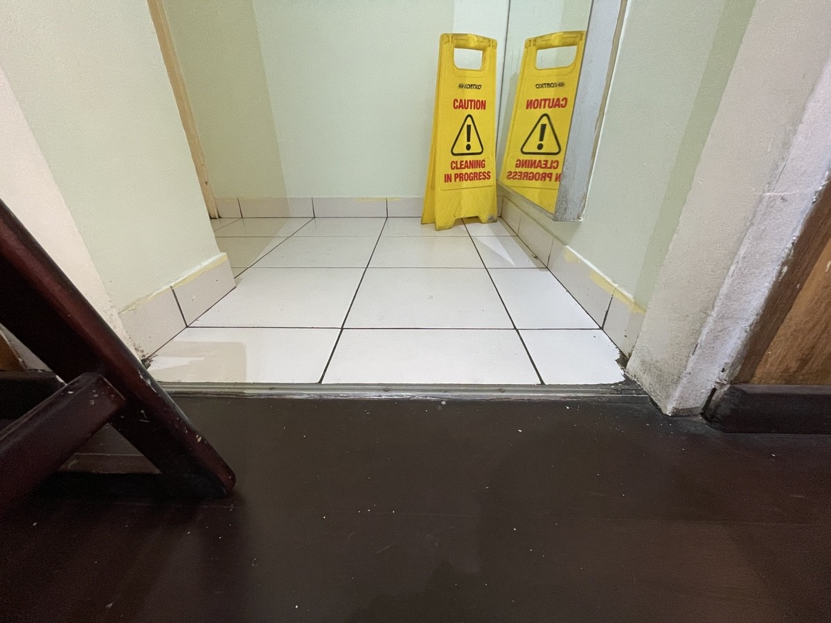 Metal bump at foot of archway.