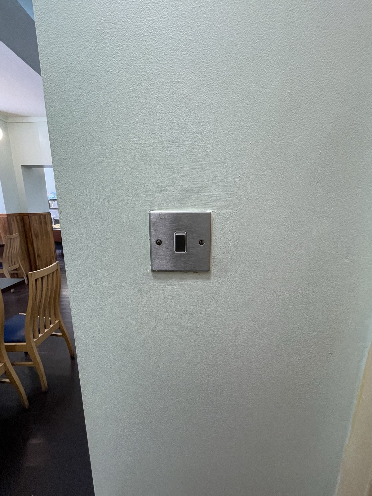 Light switch on left of door.