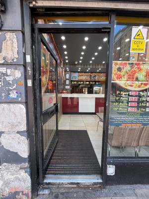 Glass door with black frame ahead.