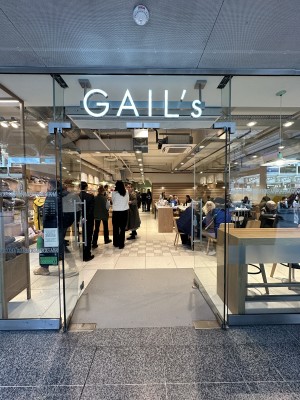 Glass doors. Push silver handles in centre to open.