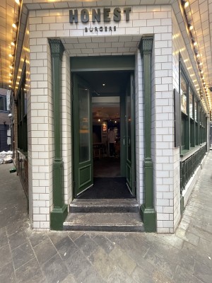 Green and glass panelled doors. Push sliver handle in centre to open.