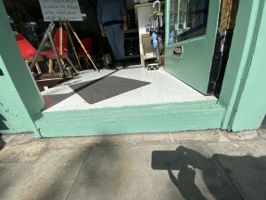 1 step up to door. Doormat following.