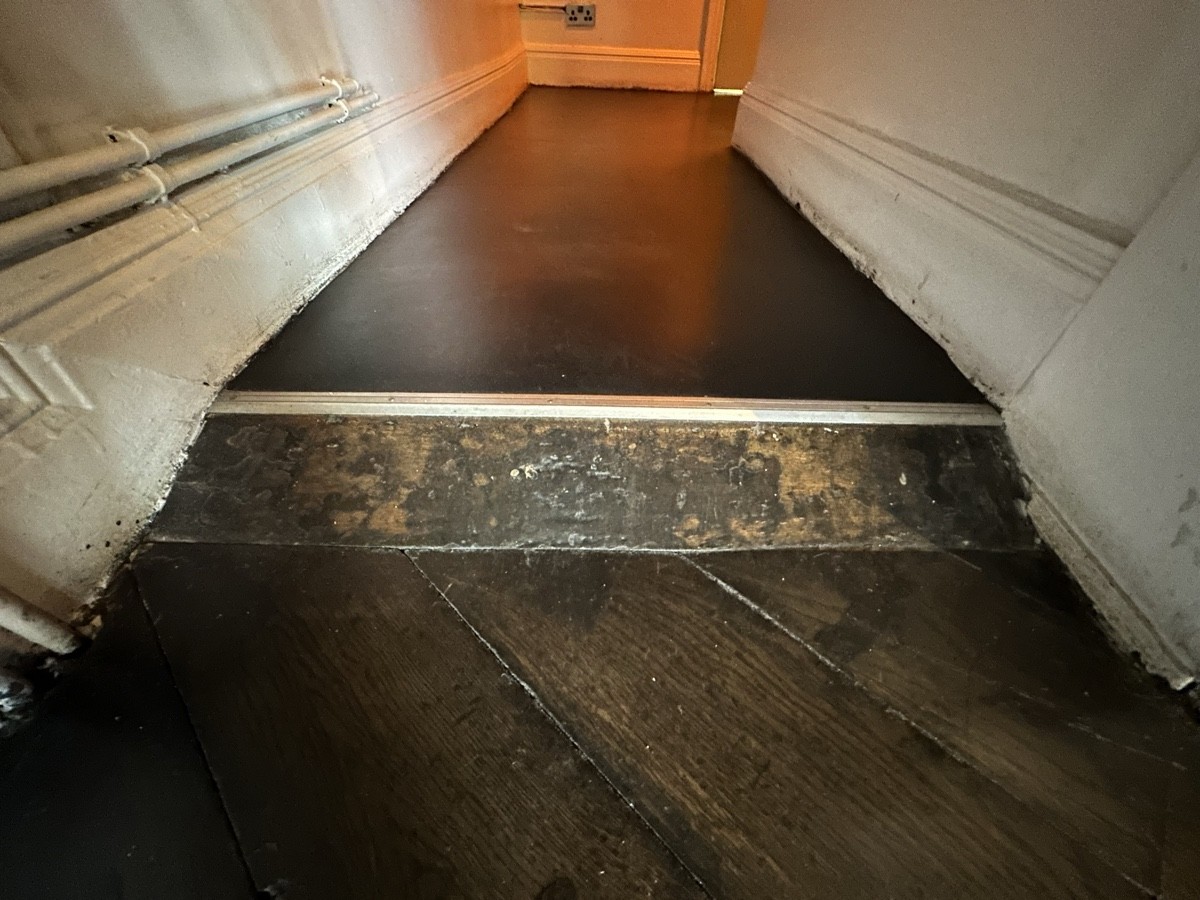 Small bump at foot of archway.