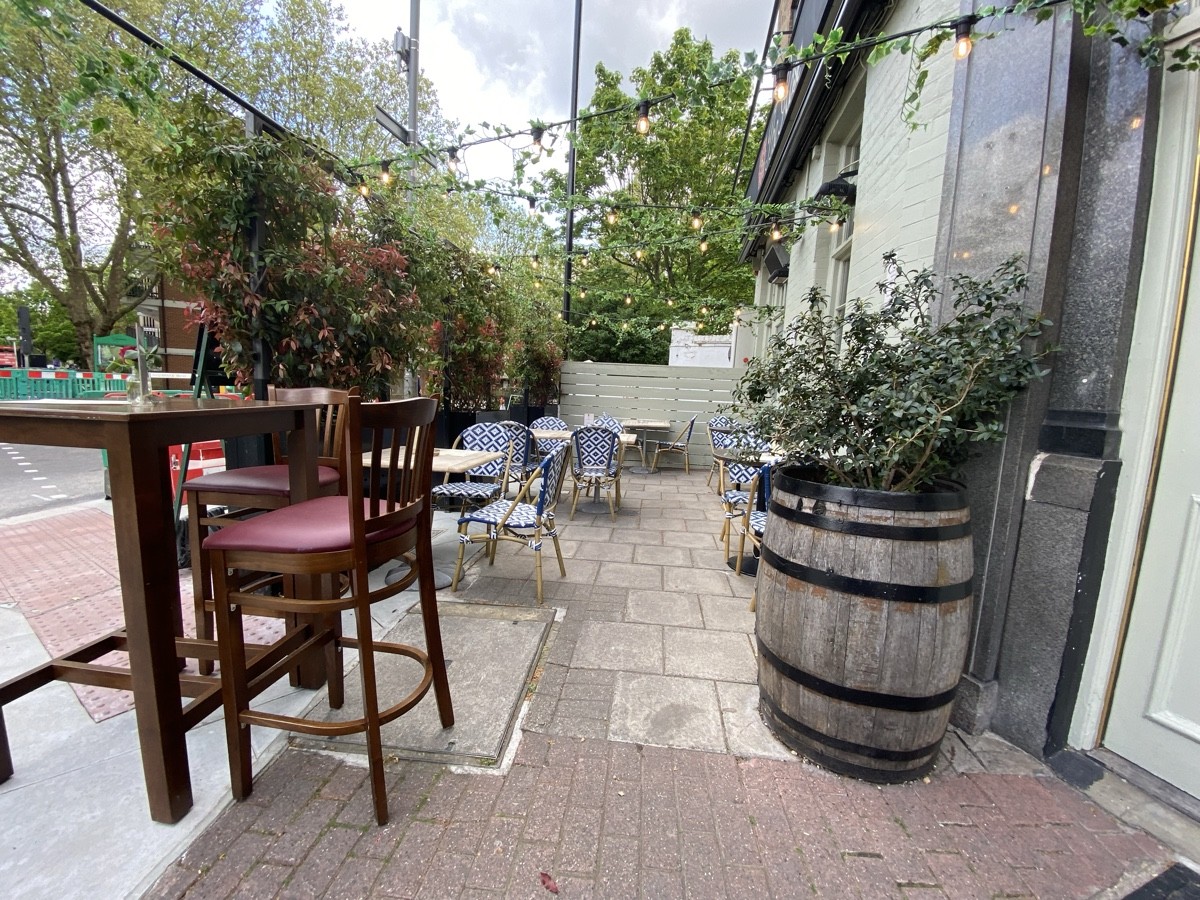 High tables and stools on right