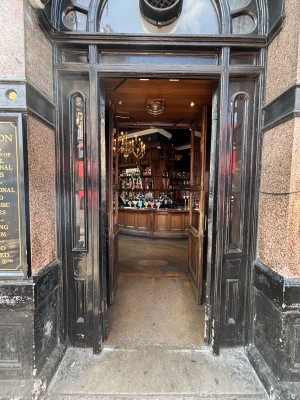 Black doors ahead. Push from centre to open.