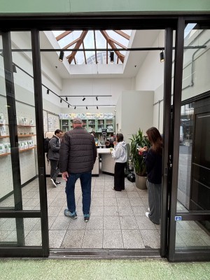 Glass doors with black frames. Slide from centre to either sides to open.