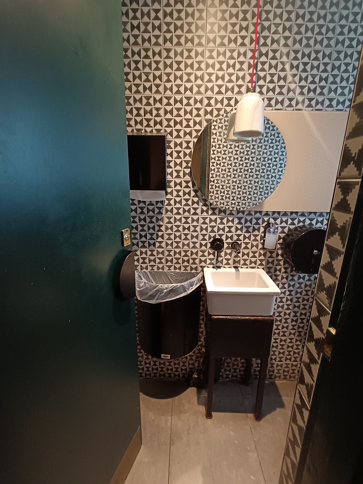 From doorway, facing straight. Sink at back.