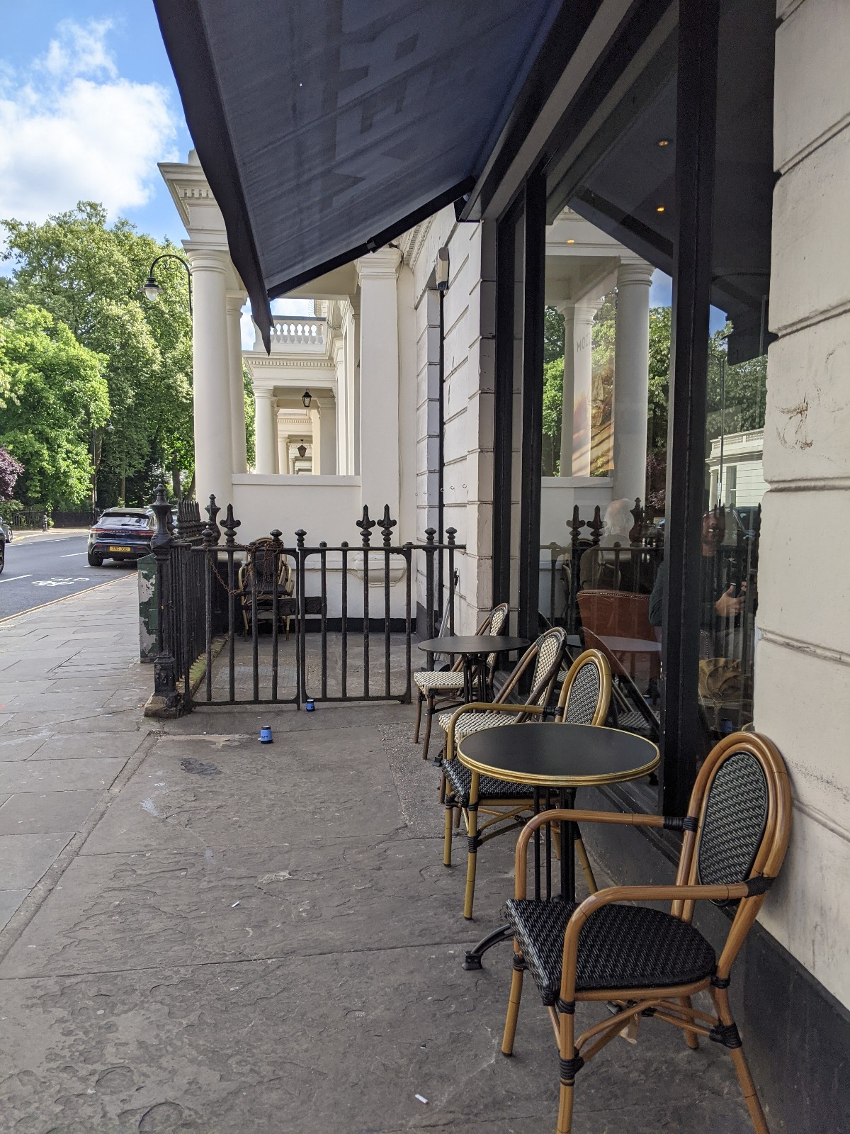 From entrance facing left. Tables with chairs along right.