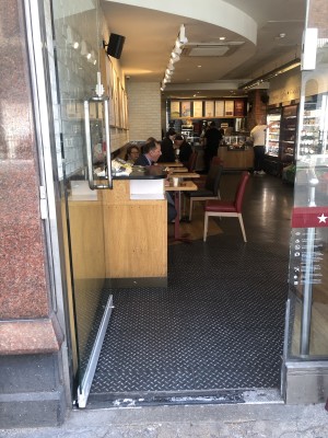 Glass door. Push handle on right to open.