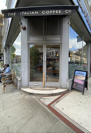 Step up followed by glass doors. Pull from centre to open.