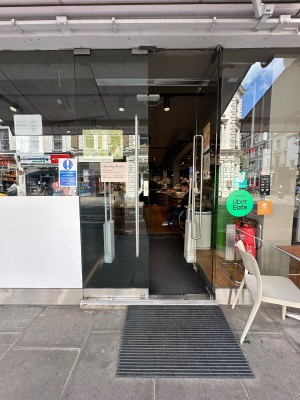Glass doors. Push silver handles in centre to open.
