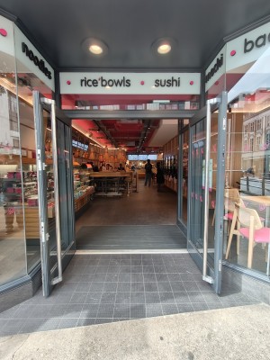 Grey framed glass doors. Pull silver handles on centre to open.