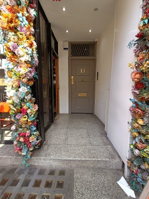 From street, facing venue. Step up to opening ahead.