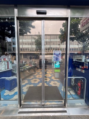 Glass doors ahead. Approach to open.