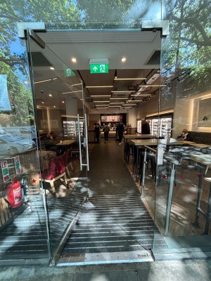 Glass door ahead. Push from right to open.