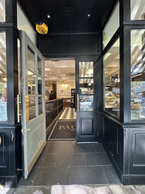 Black and glass panelled doors. Pull gold handles in centre to open.