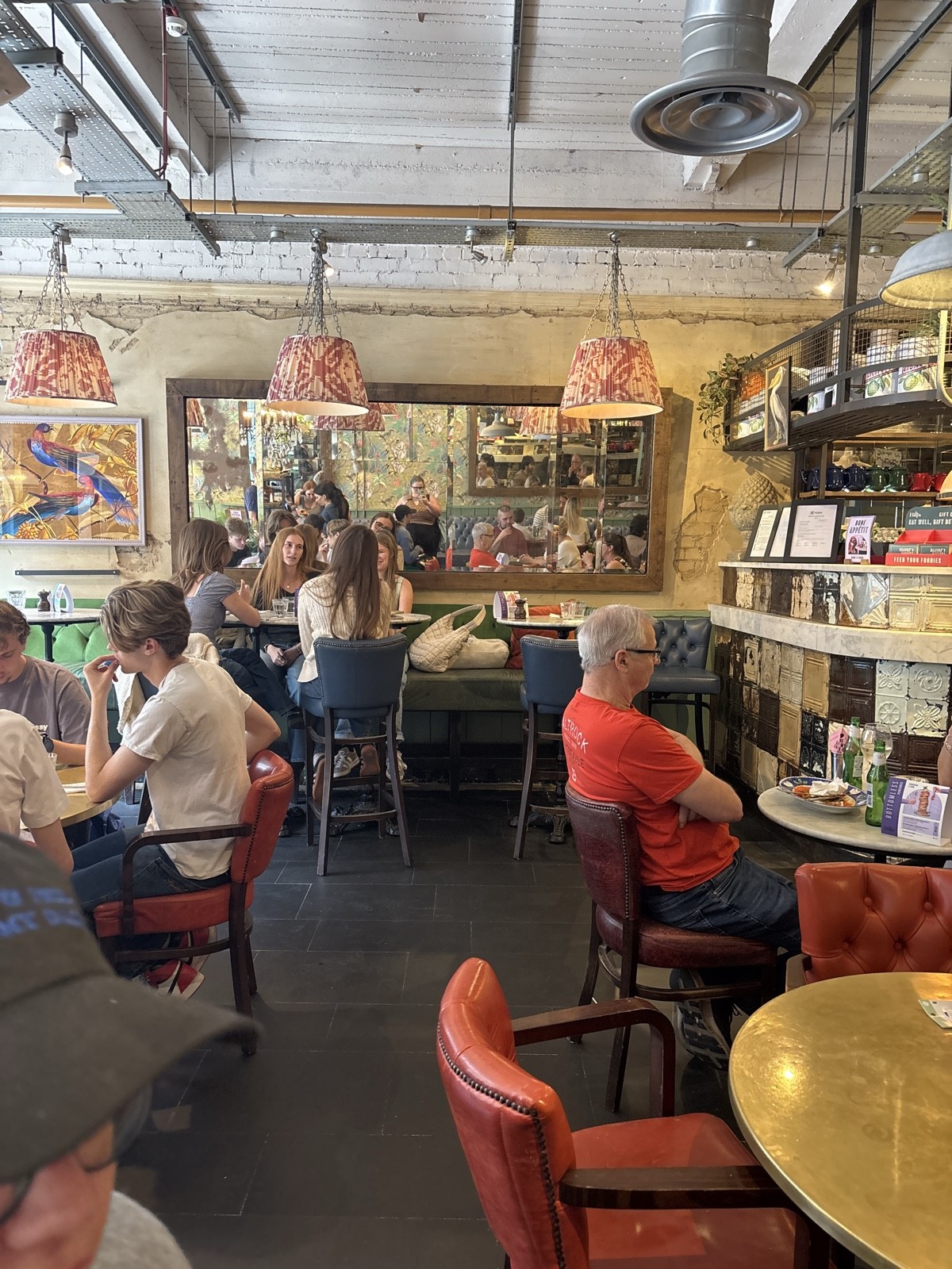 a photograph which shows that most tables are at seated height,but some require barstools