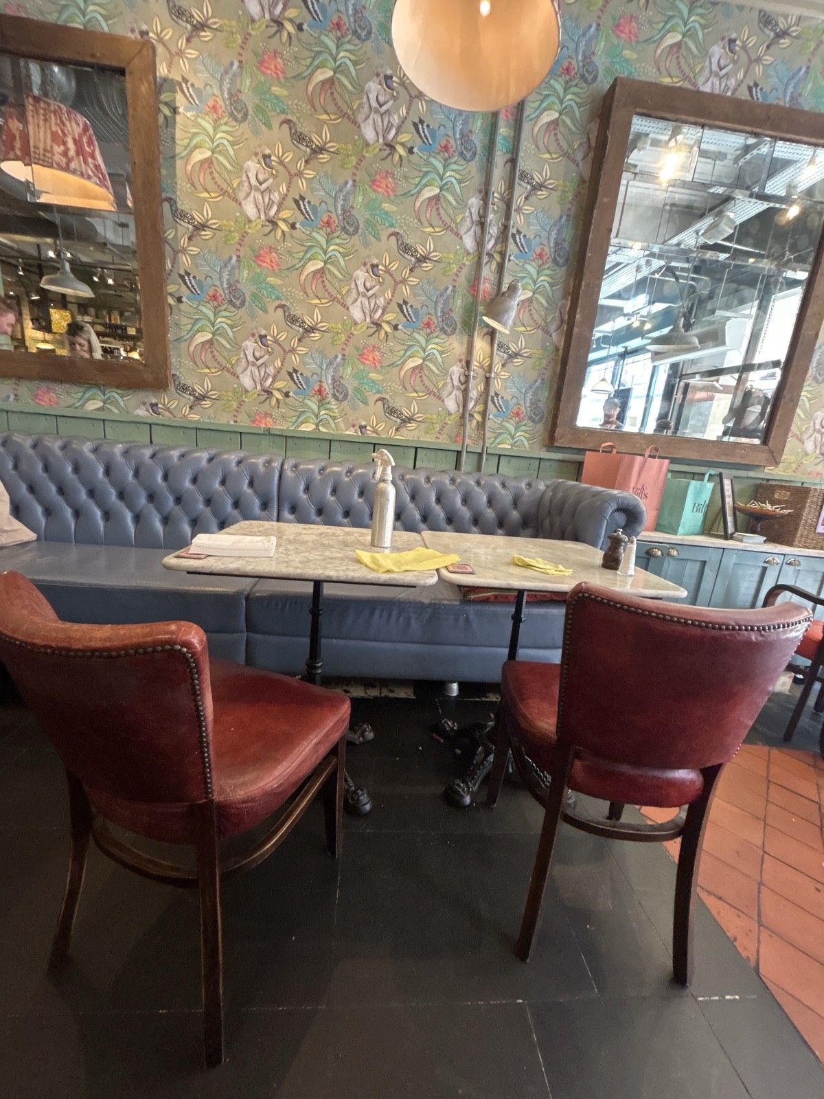 Close up of a 4 person table (2 tables put together)
It is a standard seated height and has 2 removable chairs
The table has a cross base