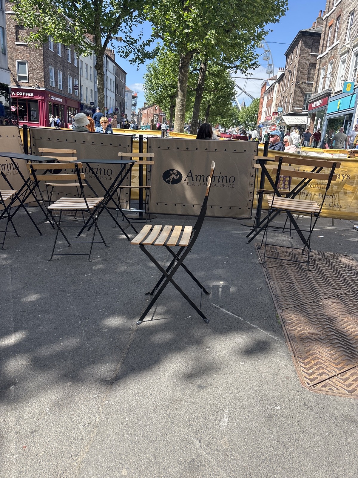 the ground is not even and the seating area is on the edge of a “hill” which would be difficult for mobility aids which don’t have brakes
