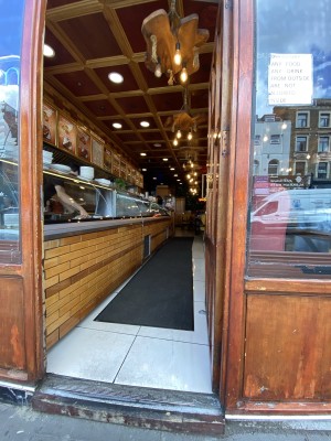 Wooden door with glass panel ahead.