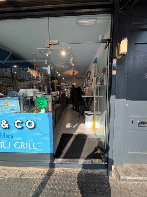 Glass door ahead. Push to open via handle on left.