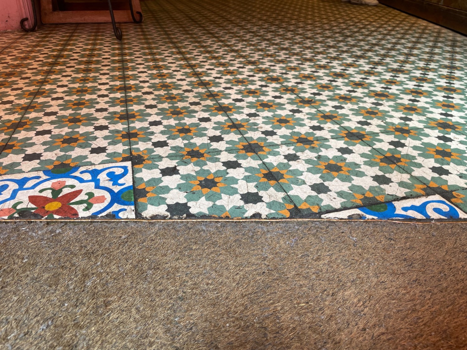 Metal bump at end of carpeted area. Main area ahead.