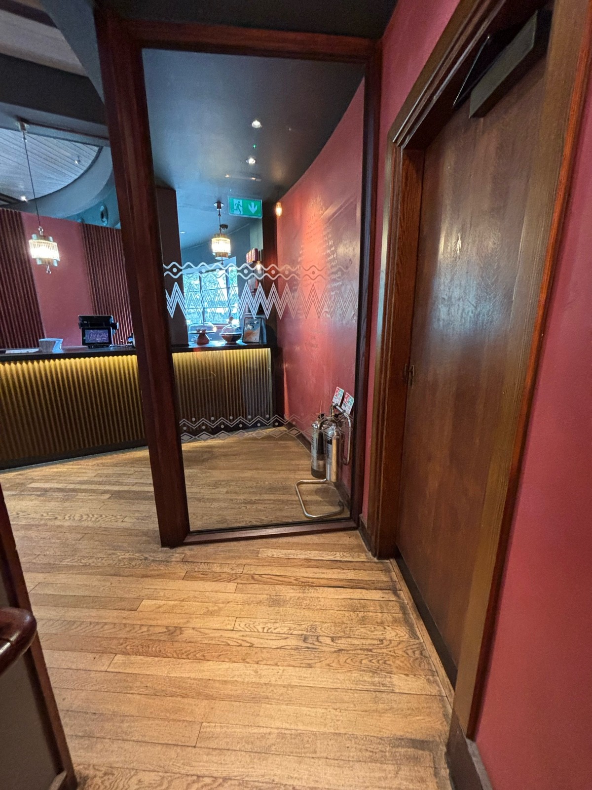 From top of stairs facing straight. Glass divider ahead.