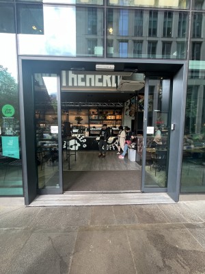 Grey framed glass doors. Doors slide from centre to open.