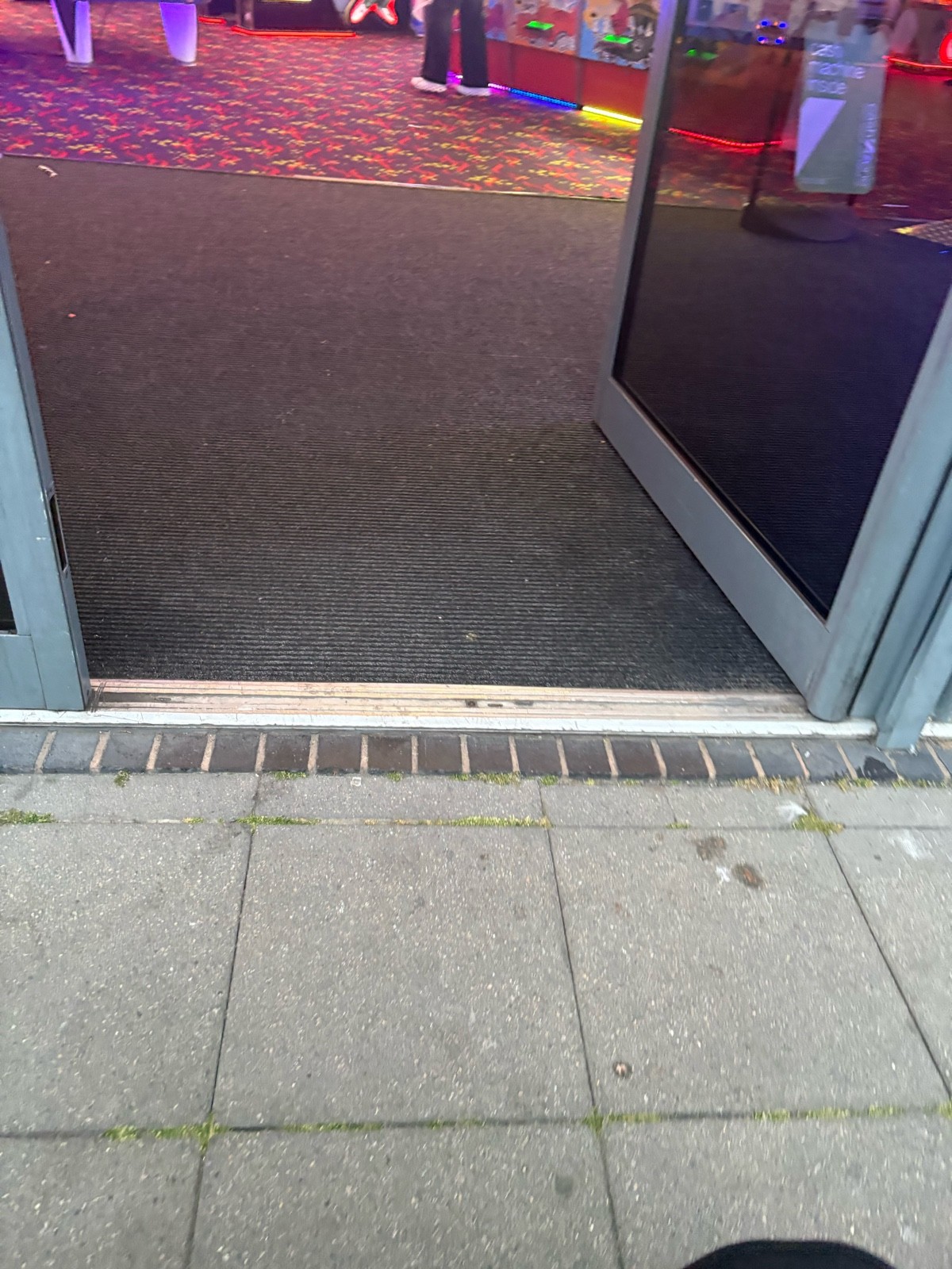 The door , only one door was open but there were no steps it was a tiny little lip to get in