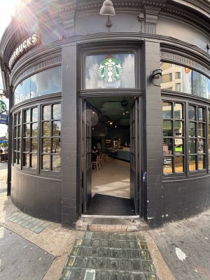 Black doors with glass panels ahead. Push doors from center to open.
