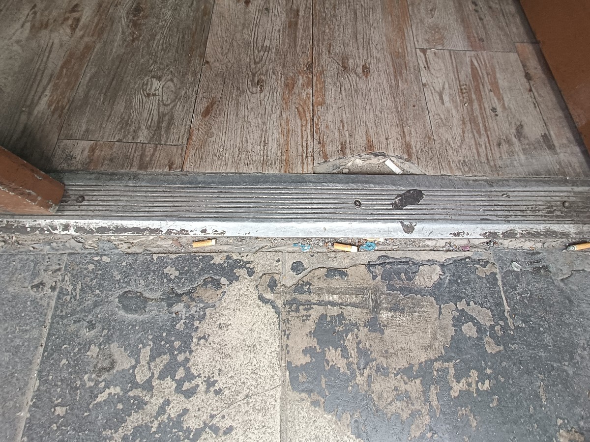 Small bump at threshold, doormat after.