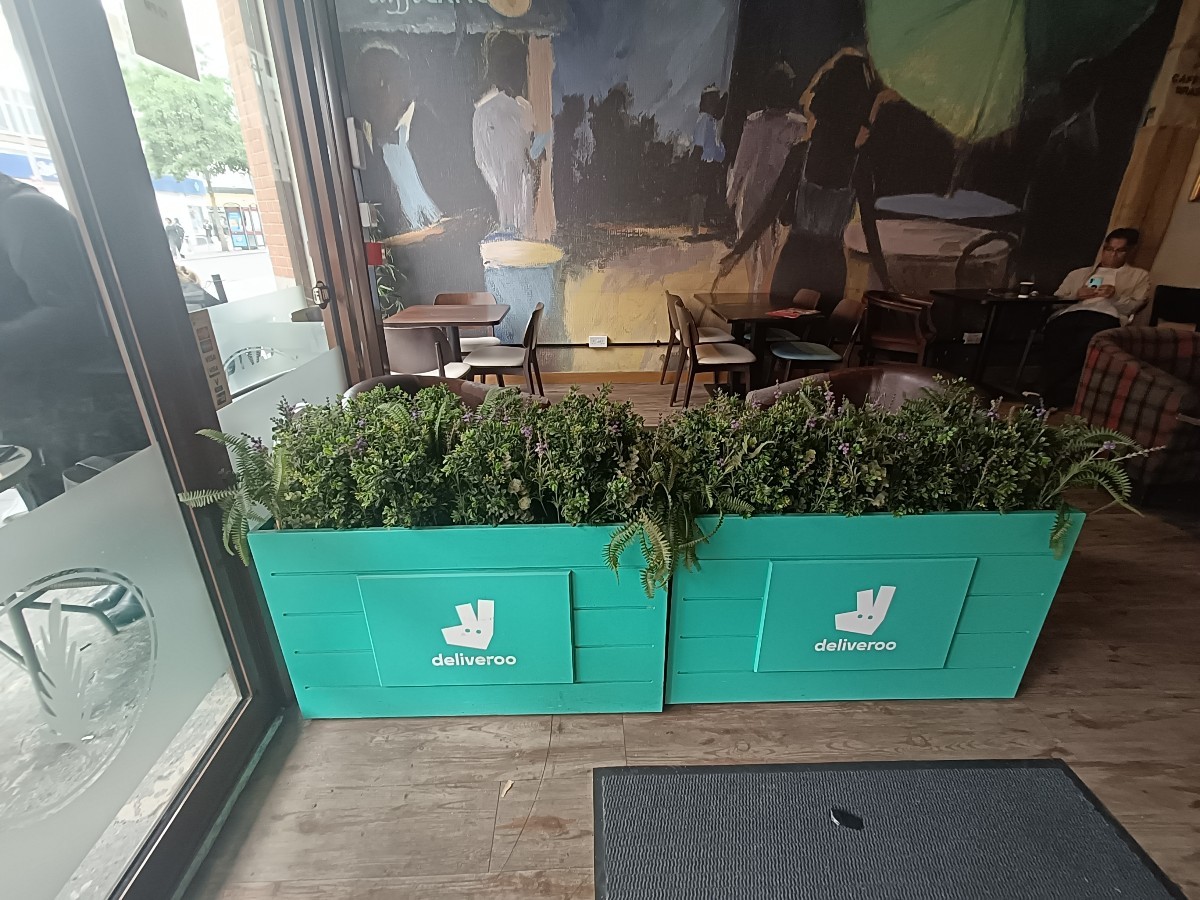 From entrance, facing left. Planters along back.