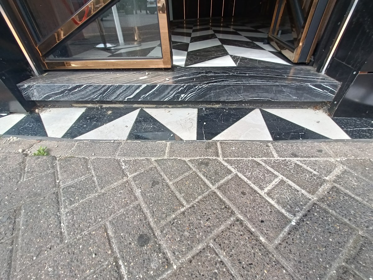 Step up before doorway.