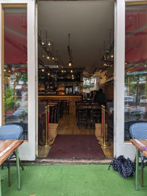 Glass doors with white frame. Pull from centre to open.