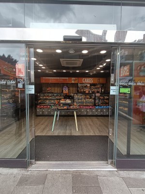 Glass doors ahead. Open automatically from center.