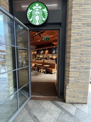 Glass door with grey frame. Pull from left to open.