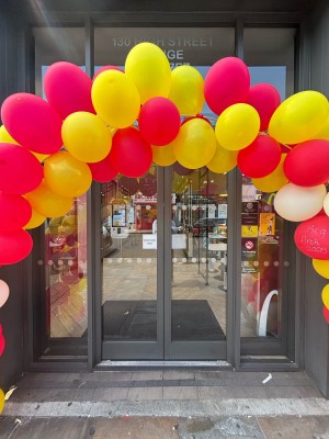 Glass doors with grey frames. Approach to open.