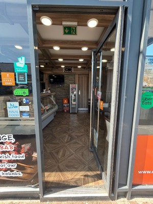 Glass door ahead. Push from left handle to open.