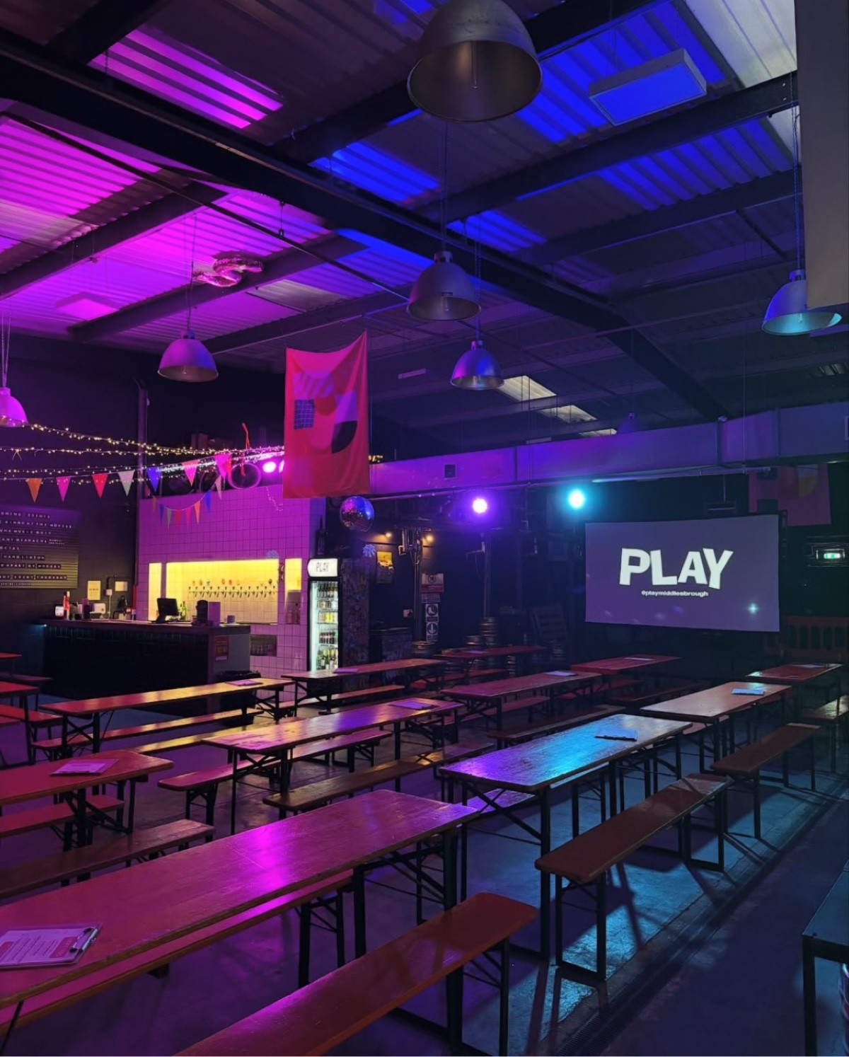 Open plan area showing bar at the back, height bar