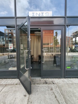 Black framed glass doors. Pull silver handles in centre to open.
