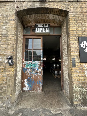 Wood and glass panelled doors. Push from centre to open.