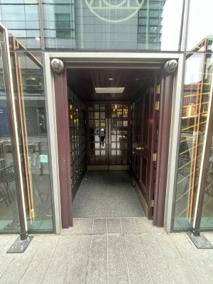 Single brown door with good knob handle. Push handle on left of preceding door to open.